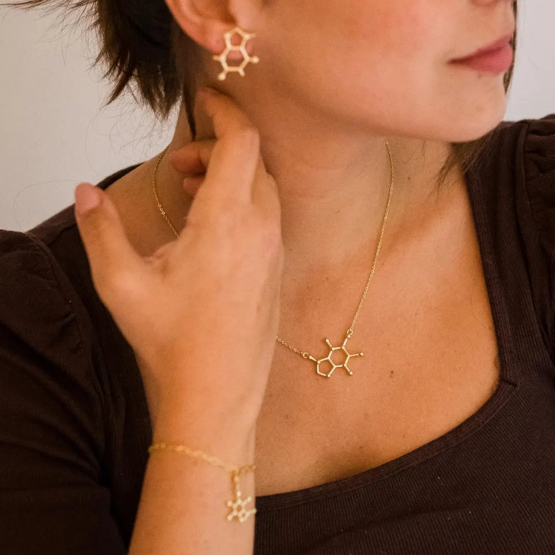 Model wearing caffeine molecule necklace in gold - science inspired jewellery gift for coffee lovers| My Chemical Gift