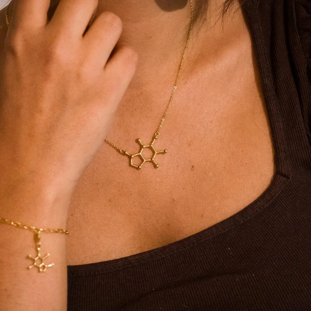 Model wearing caffeine molecule necklace in gold - science inspired jewellery gift for coffee lovers| My Chemical Gift