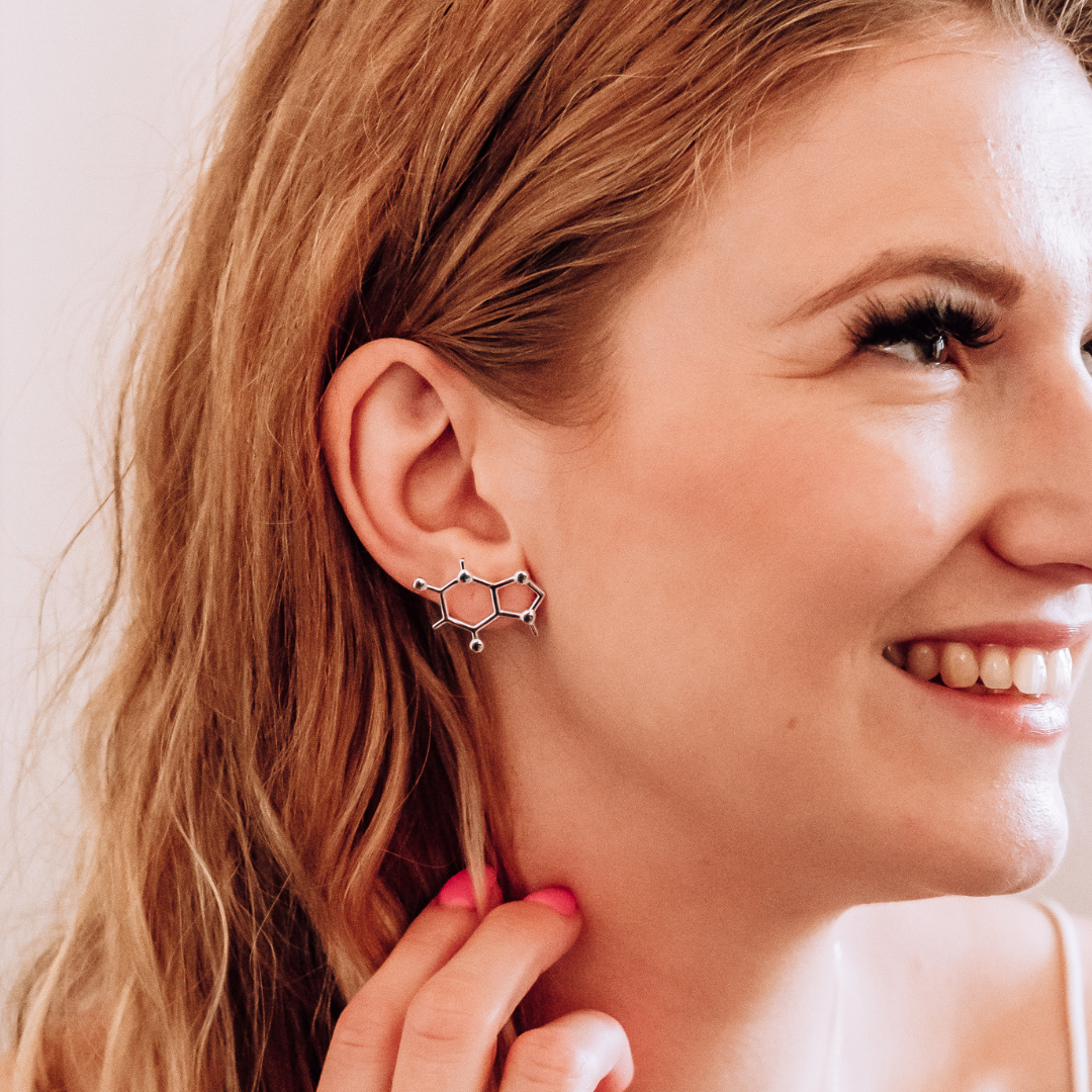 Model wearing caffeine molecule earrings in silver - chemistry inspired jewellery gift for coffee lovers | My Chemical Gift