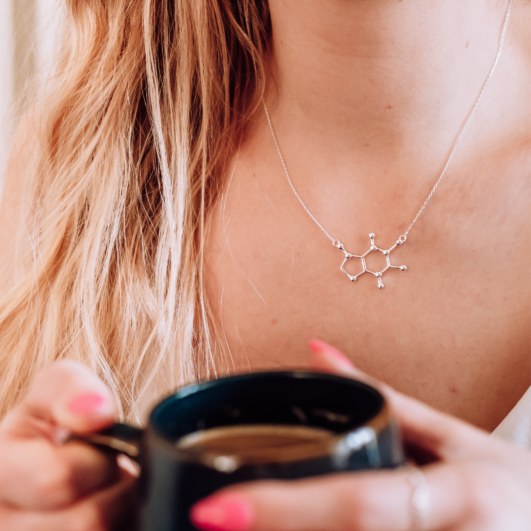 Model wearing caffeine molecule necklace in silver - chemistry inspired jewellery gift for coffee lovers | My Chemical Gift