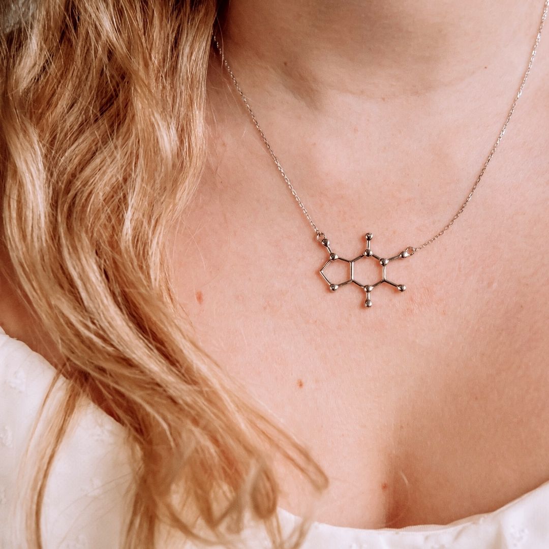 Model wearing caffeine molecule necklace in silver - chemistry inspired jewellery gift for coffee lovers | My Chemical Gift