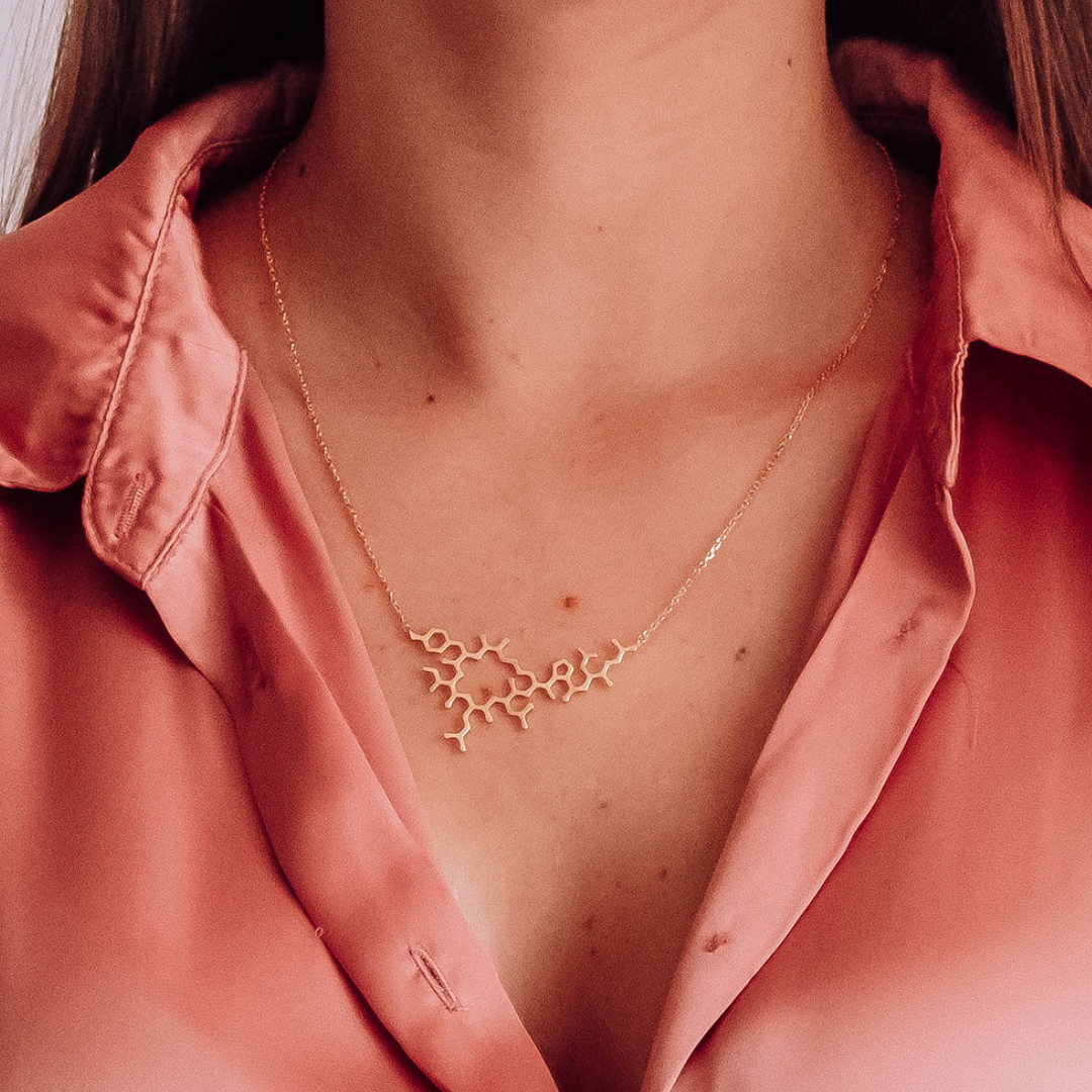 Model wearing oxytocin molecule necklace in gold - love hormone pendant| My Chemical Gift
