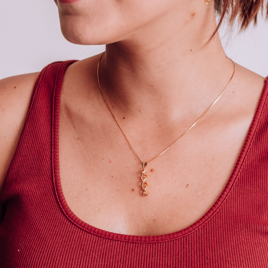 Model wearing DNA double helix necklace in gold - chemistry inspired jewellery gift for science lovers | My Chemical Gift