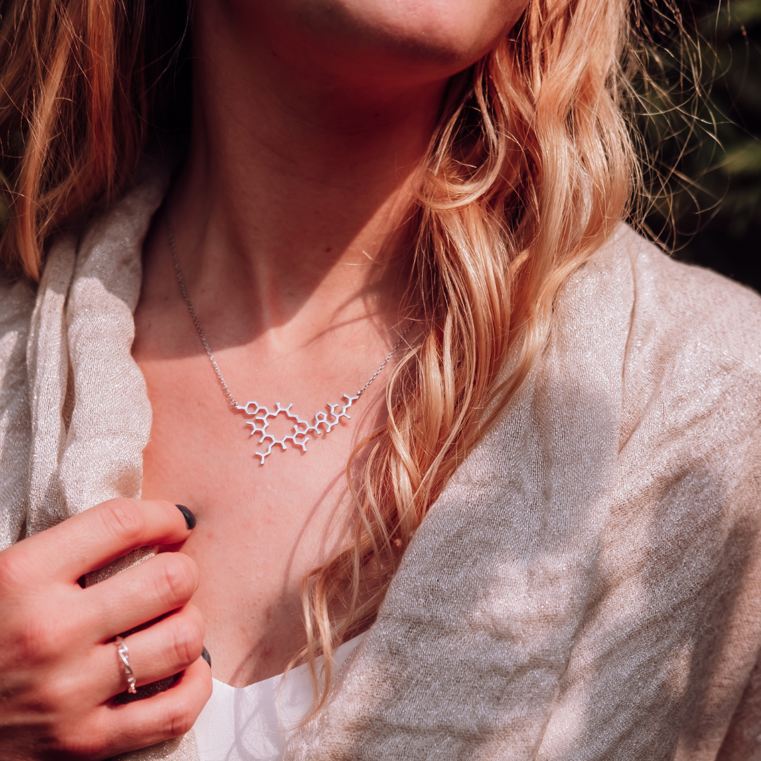 Model wearing oxytocin molecule necklace in silver - love hormone pendant | My Chemical Gift