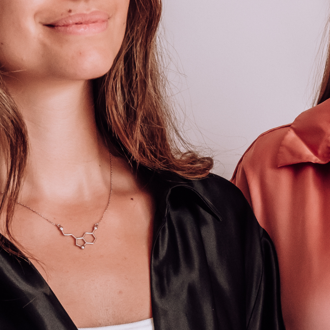 Model wearing serotonin molecule necklace in silver - chemistry inspired jewellery gift for science lovers | My Chemical Gift