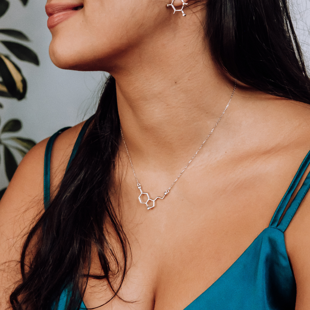 Model wearing serotonin molecule necklace in silver - chemistry inspired jewellery gift for science lovers | My Chemical Gift
