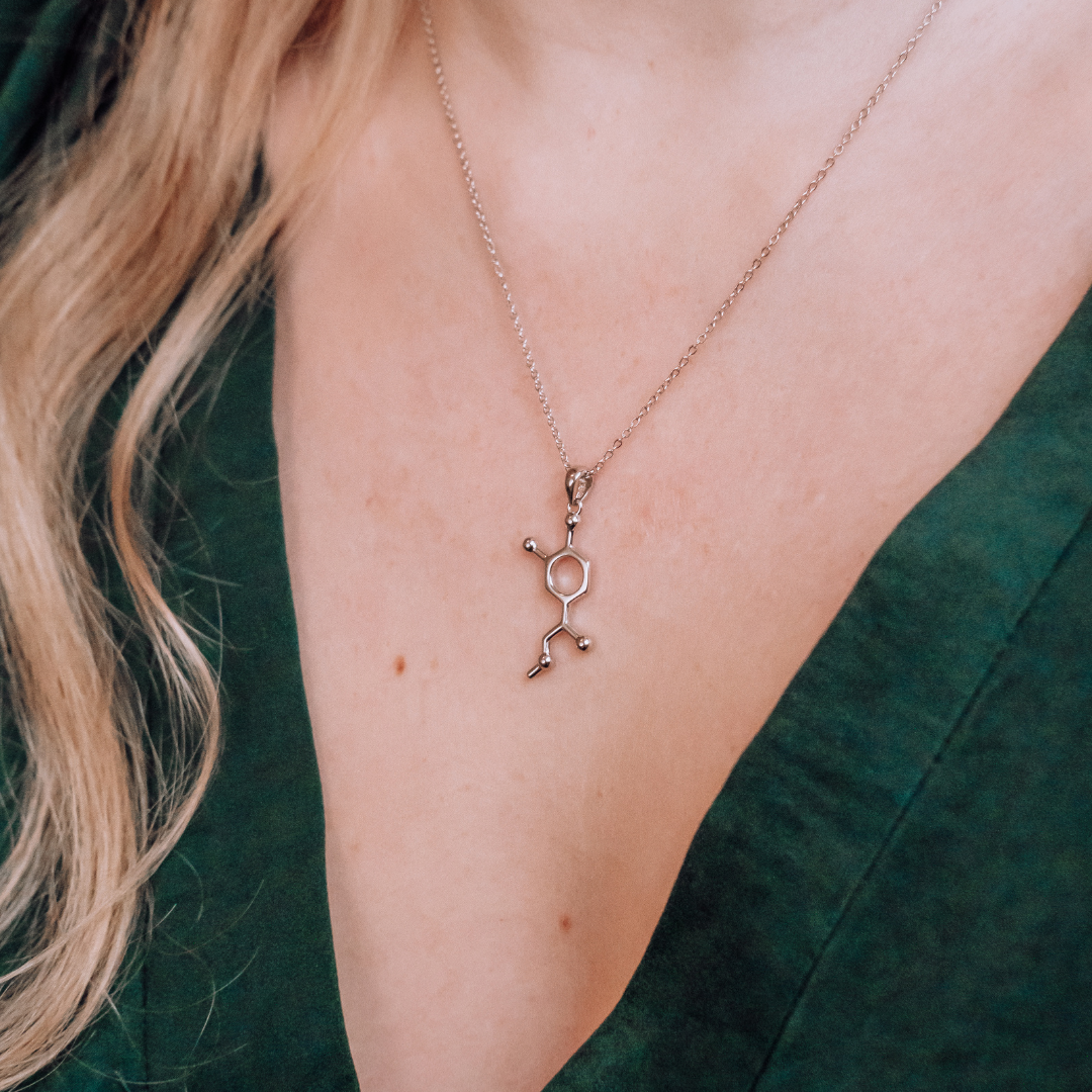 Model wearing adrenaline molecule necklace in silver - chemistry inspired jewellery gift for science lovers | My Chemical Gift