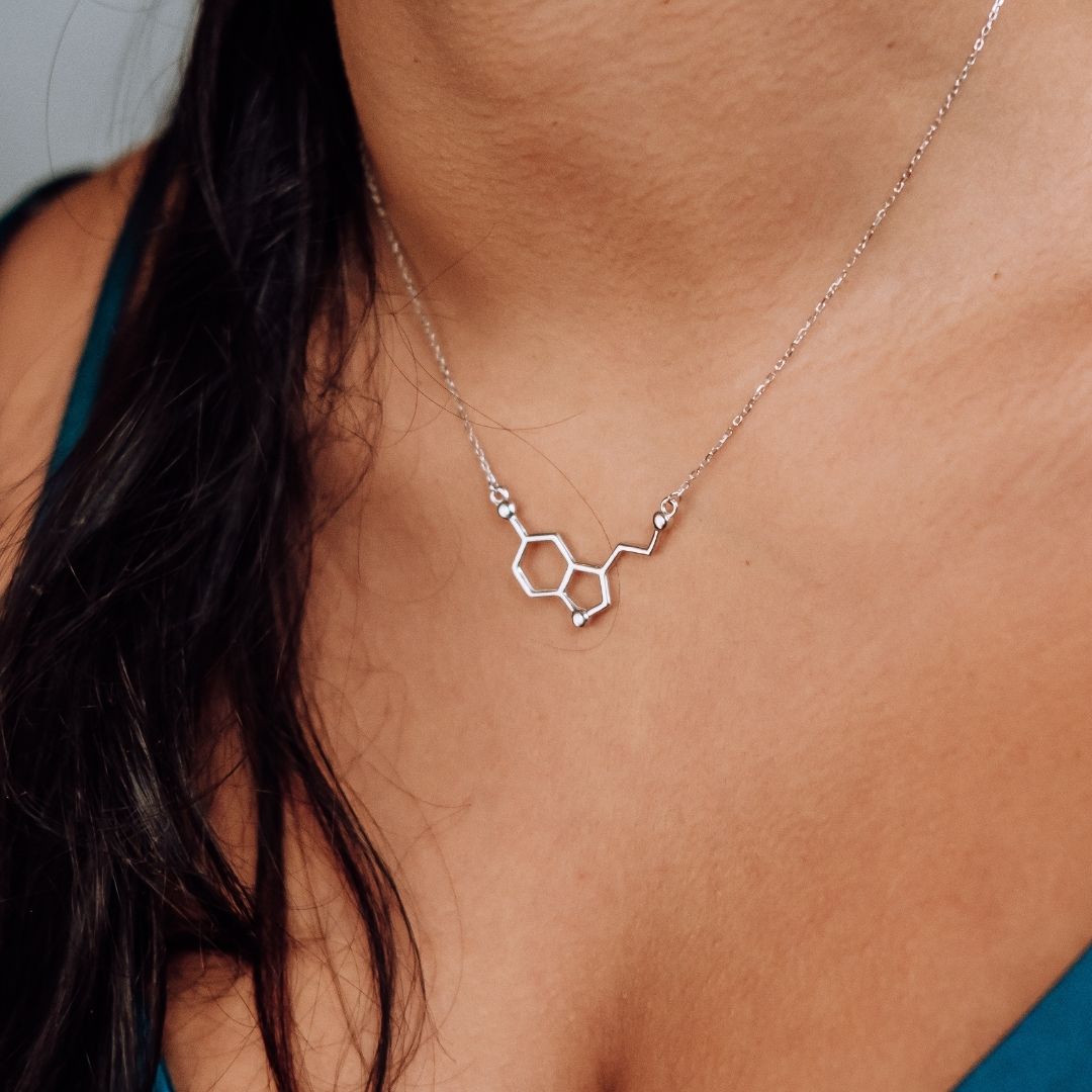 Model wearing serotonin molecule necklace in silver - chemistry inspired jewellery gift for science lovers | My Chemical Gift