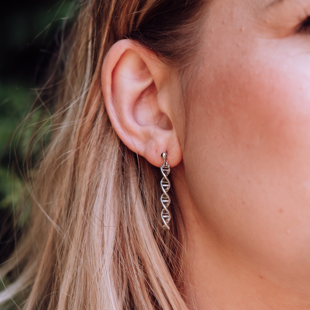 Model wearing DNA double helix earrings in silver - chemistry inspired jewellery gift for science lovers | My Chemical Gift