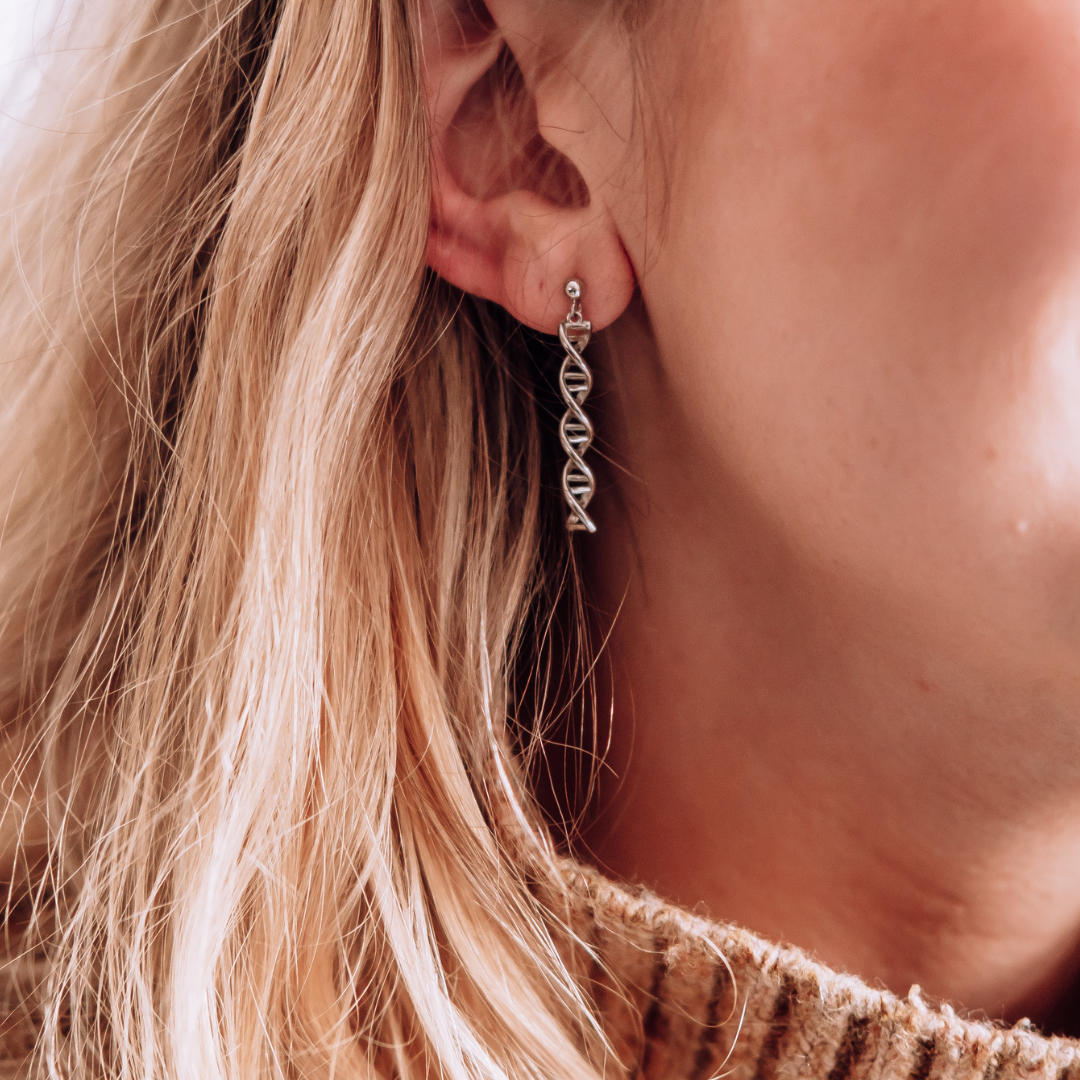 Model wearing DNA double helix earrings in silver - chemistry inspired jewellery gift for science lovers | My Chemical Gift