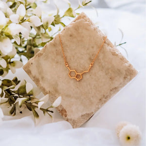 Serotonin molecule necklace in gold - chemistry inspired jewellery for science lovers 