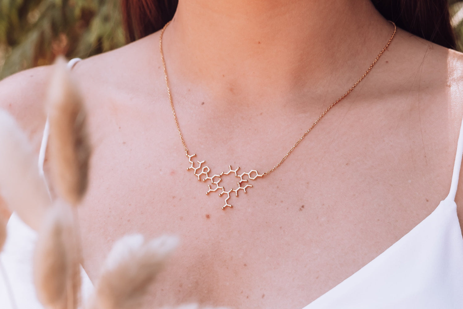 Gold oxytocin molecule necklace