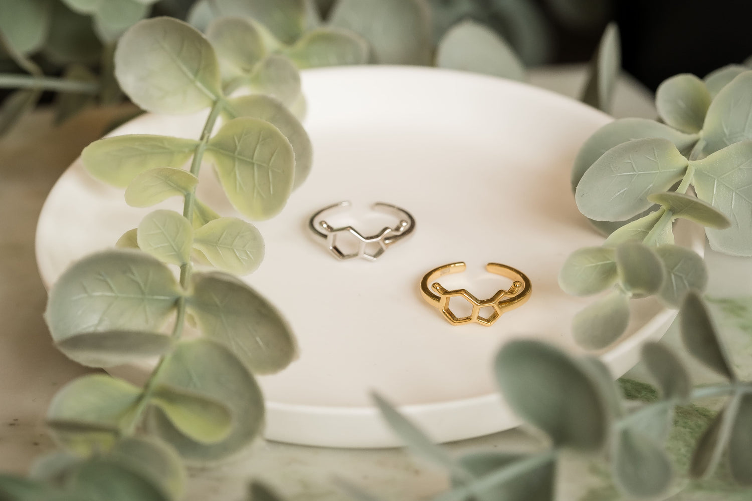 Serotonin molecule shaped rings on a white surface