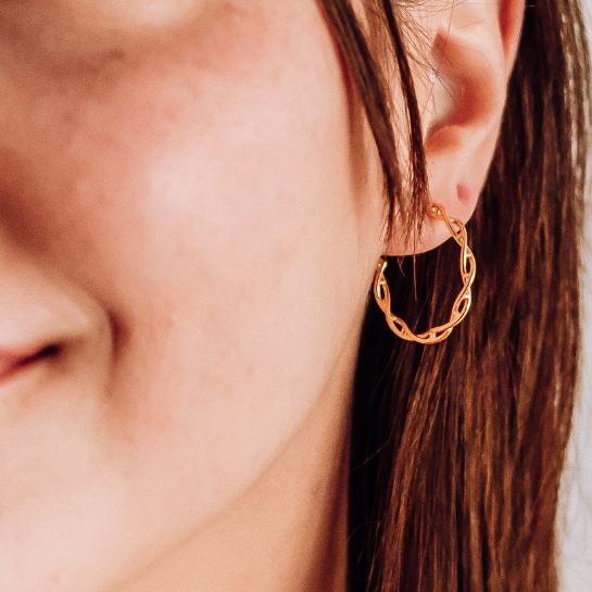 Model wearing DNA double helix hoop earrings in gold - chemistry inspired jewellery for science lovers | My Chemical Gift