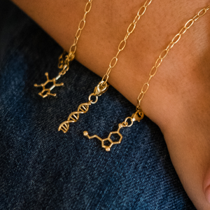 DNA double helix and serotonin molecule gold charm bracelet - chemistry inspired jewellery for science lovers | My Chemical Gift