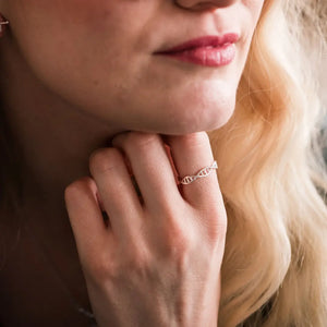 Model wearing DNA double helix ring in silver - chemistry inspired jewellery gift for science lovers