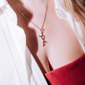 Model wearing adrenaline molecule necklace in silver - chemistry inspired jewellery gift for science lovers 