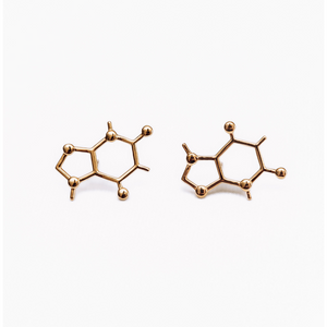 caffeine molecule gold stud earrings on white background