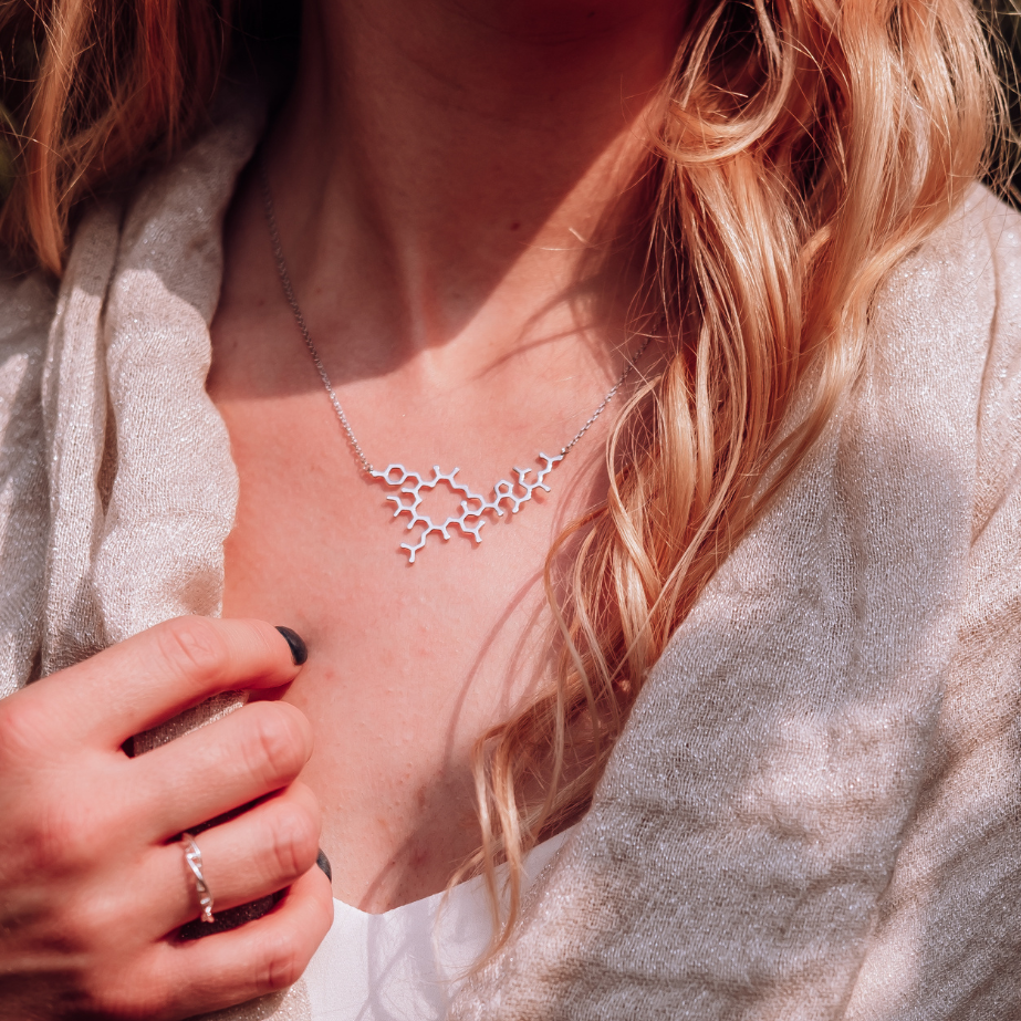 Model wearing oxytocin molecule necklace in silver - love hormone pendant | My Chemical Gift