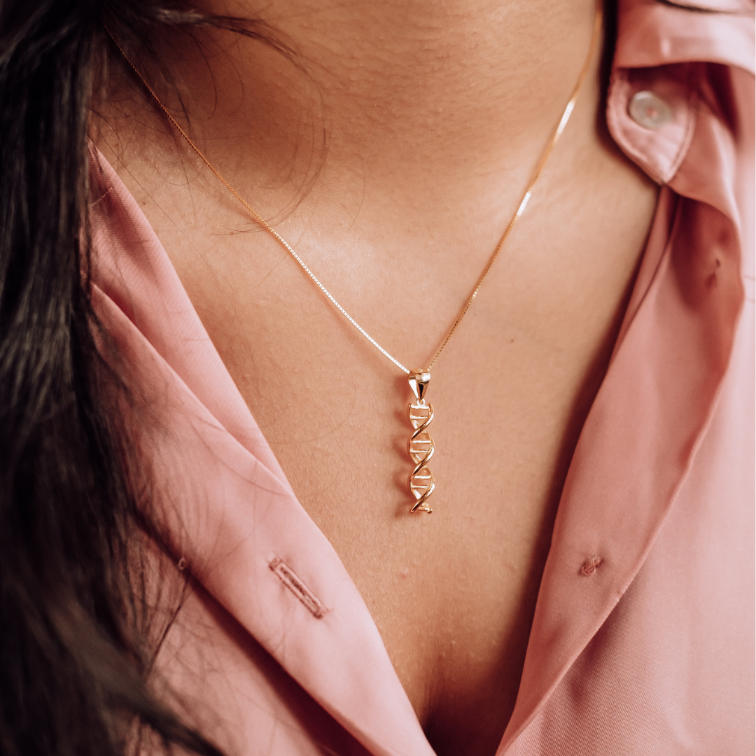 Model wearing DNA double helix necklace in gold - chemistry inspired jewellery gift for science lovers | My Chemical Gift