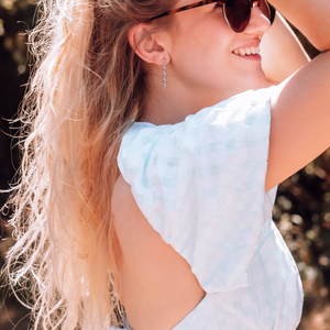 Model wearing DNA double helix earrings in silver - chemistry inspired jewellery gift for science lovers | My Chemical Gift