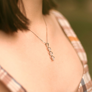 Model wearing DNA double helix necklace in silver - chemistry inspired jewellery gift for science lovers | My Chemical Gift