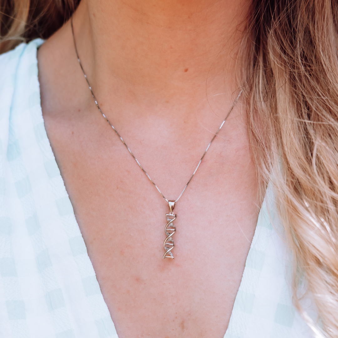Model wearing DNA double helix necklace in silver - chemistry inspired jewellery gift for science lovers | My Chemical Gift